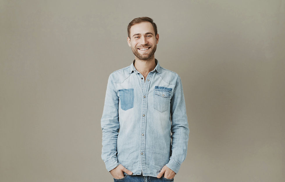 Man wearing demin button up shirt