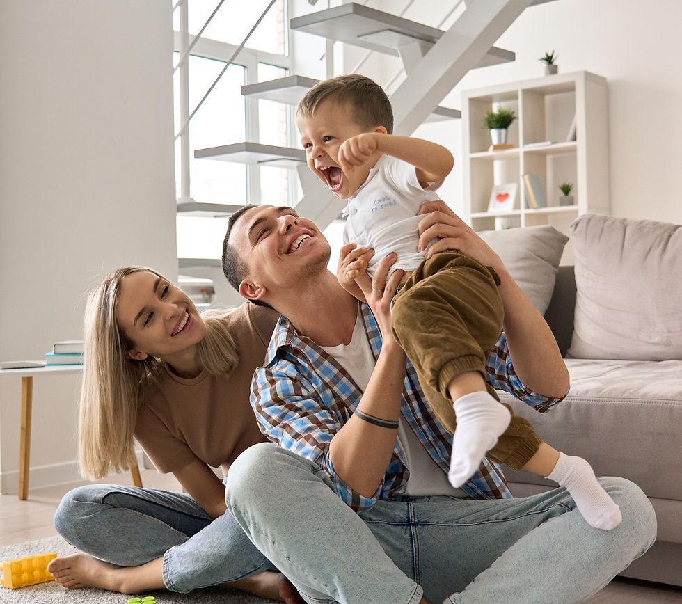 Family smiling and sitting on the couch