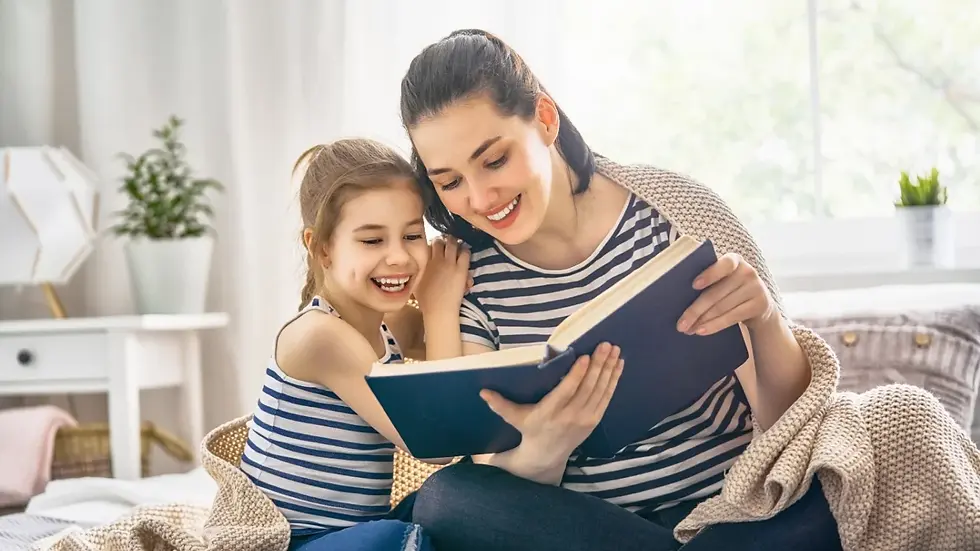 mother and daughter reading a book
