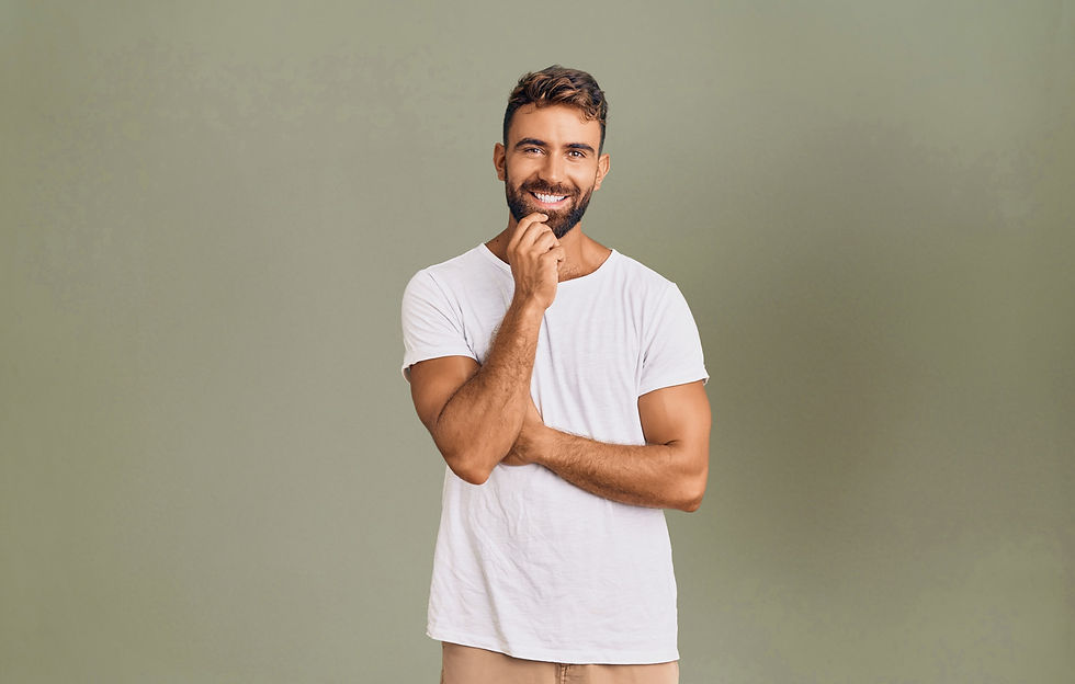 Man smiling with hand on chin
