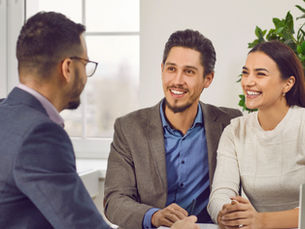 Happy young couple meeting with a fertility specialist. Source: Getty Images.  Credit: 	Lacheev