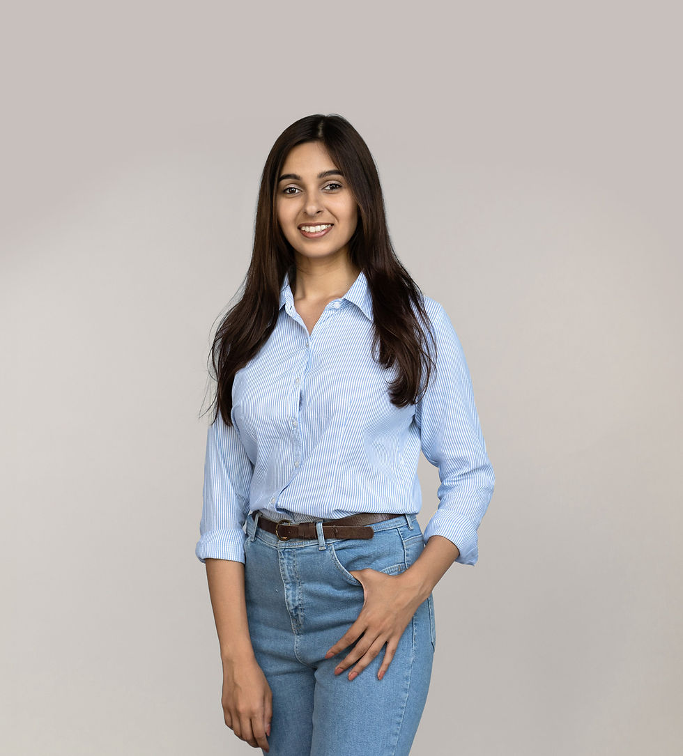 Woman smiling wearing light blue button up