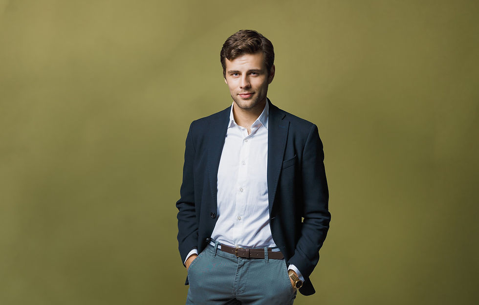 man wearing a suit with the shirt slightly unbuttoned