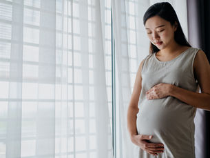 Pregnant woman touching her belly. Source: Getty Image. Credit: hxyume